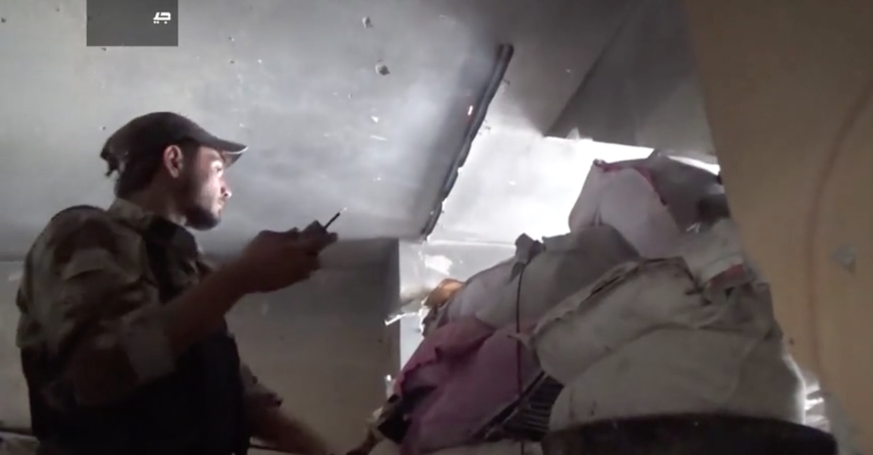 A fighter in Jaish al-Islam readies a small improvised grenade