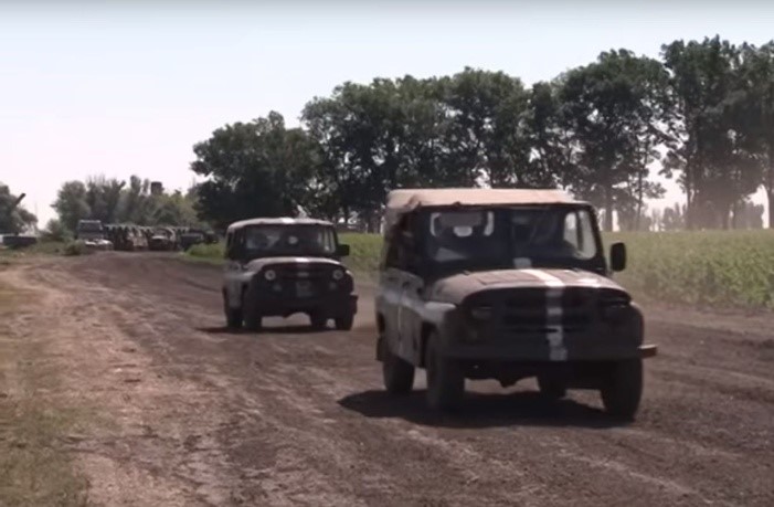 UAZ jeeps at the base, filmed on July 5, 2014