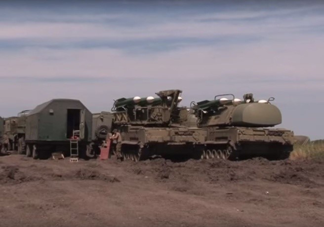 Buk missile loader (middle) and a Buk missile launcher (right)